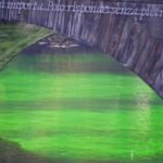 Il Po diventa verde brillante: protesta di Extinction Rebellion per il cambiamento climatico