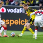 Decisione arbitrale provoca reazioni di tifosi durante la partita BVB‑Stuttgart